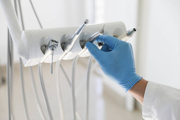 Professional Tooth Extraction technician working in Sayville, NY